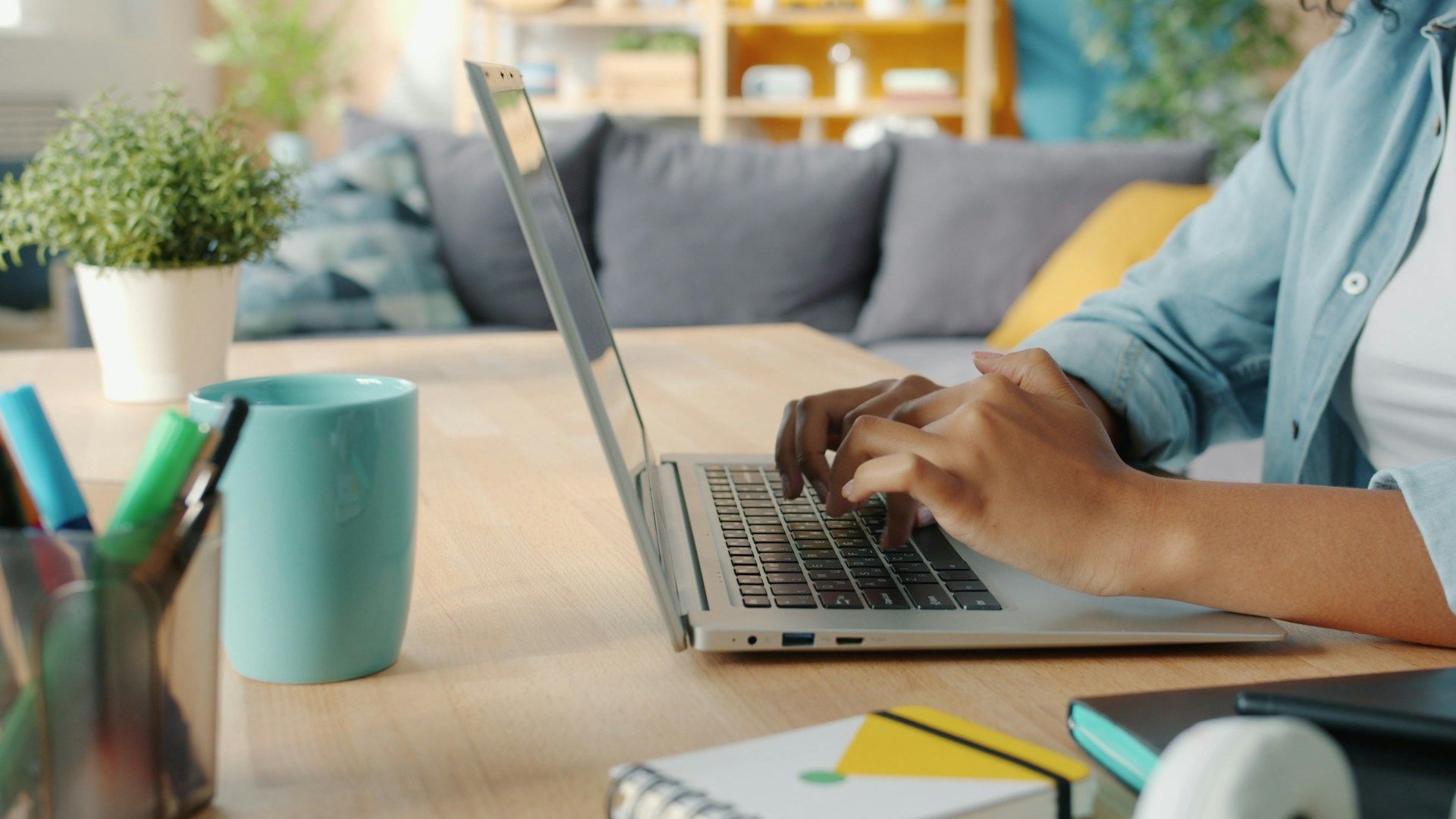 Woman studying on a laptop with others online via a live video call