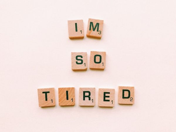 Letter blocks arranged to spell “I’m so tired”